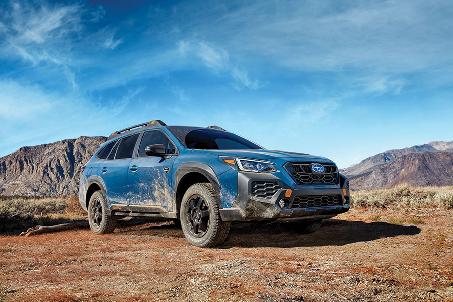 The 2024 Subaru Outback Wilderness on a dirt road in the woods