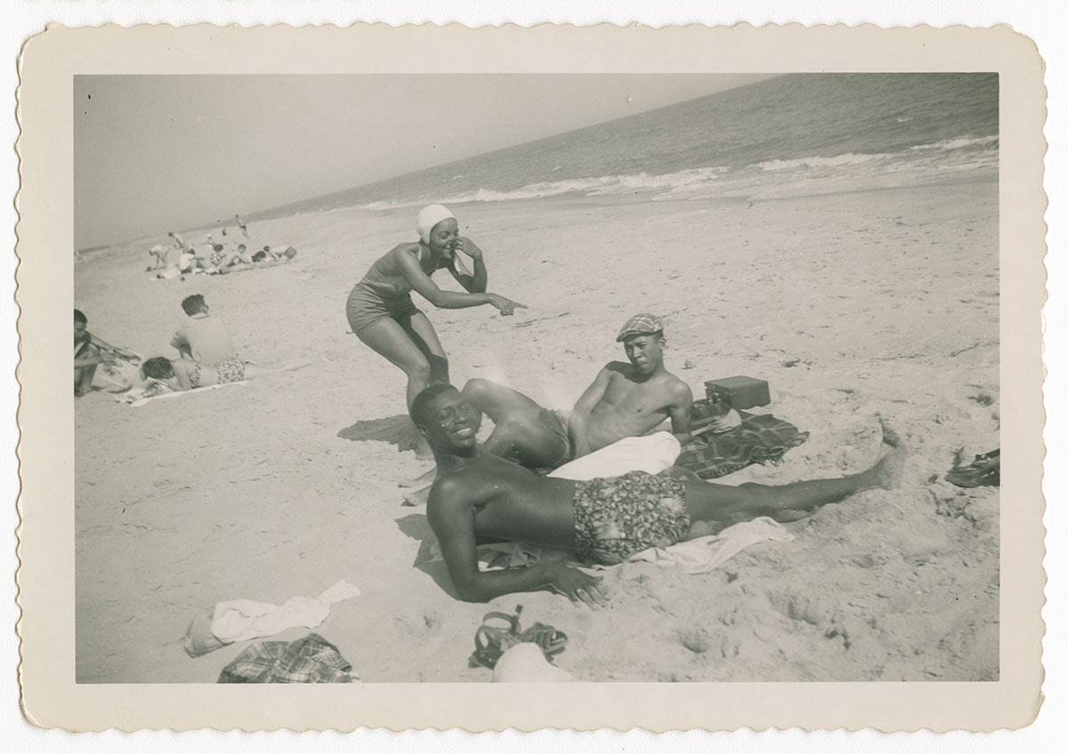 A group of people relaxing on the beach