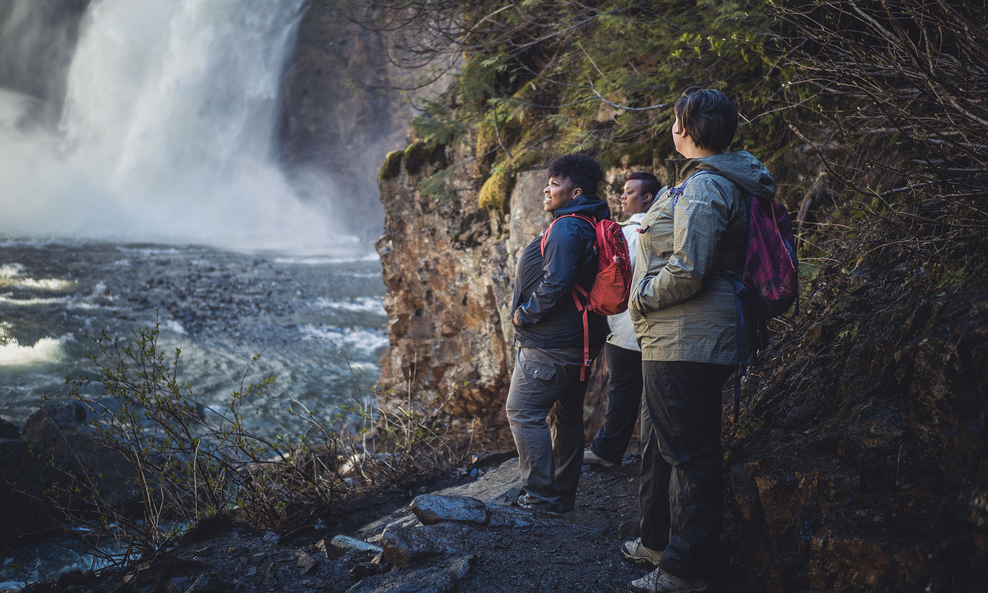 Hikers looking at a waterfall