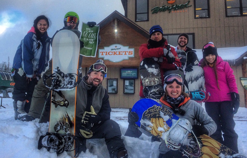 friends celebrate a day of snowboarding at a local ski resort 