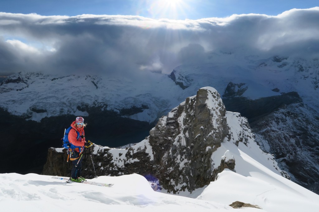 Caroline Gleich climbs a mountain in the backcountry in hopes to ski.