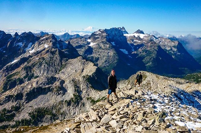 person standing in the mountains