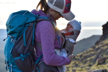 mom hiking with baby in tow