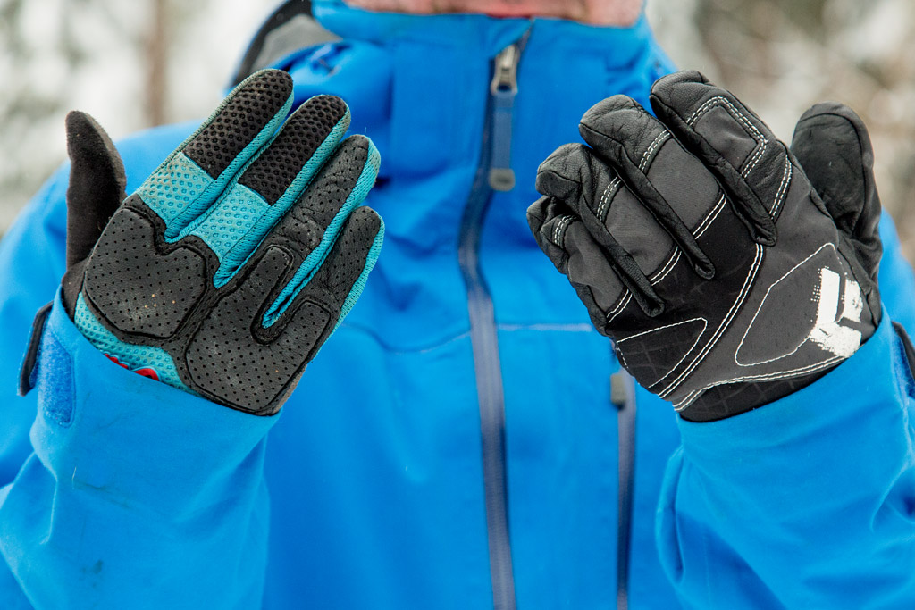 a skier wears two different gloves on his hands