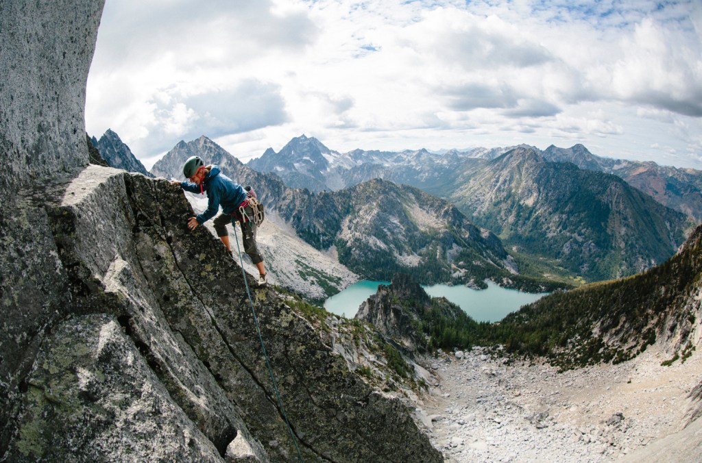 female climbing a rock ridge in Washington