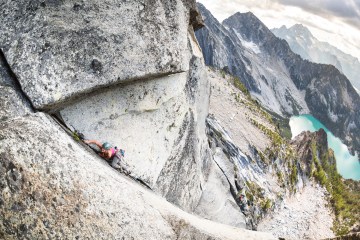 woman climbs an alpine rock climbing route in the Enchantments