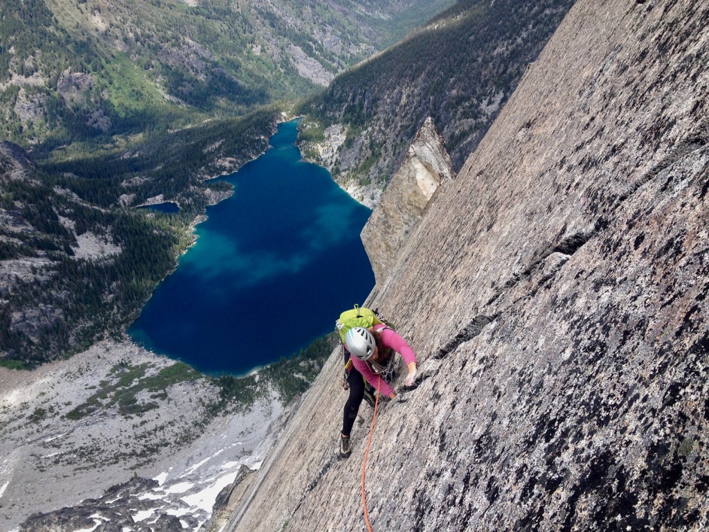 female climbing up a hand crack in the Enchantments