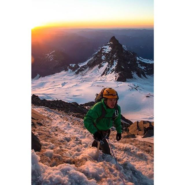 mountaineer climbing up snow