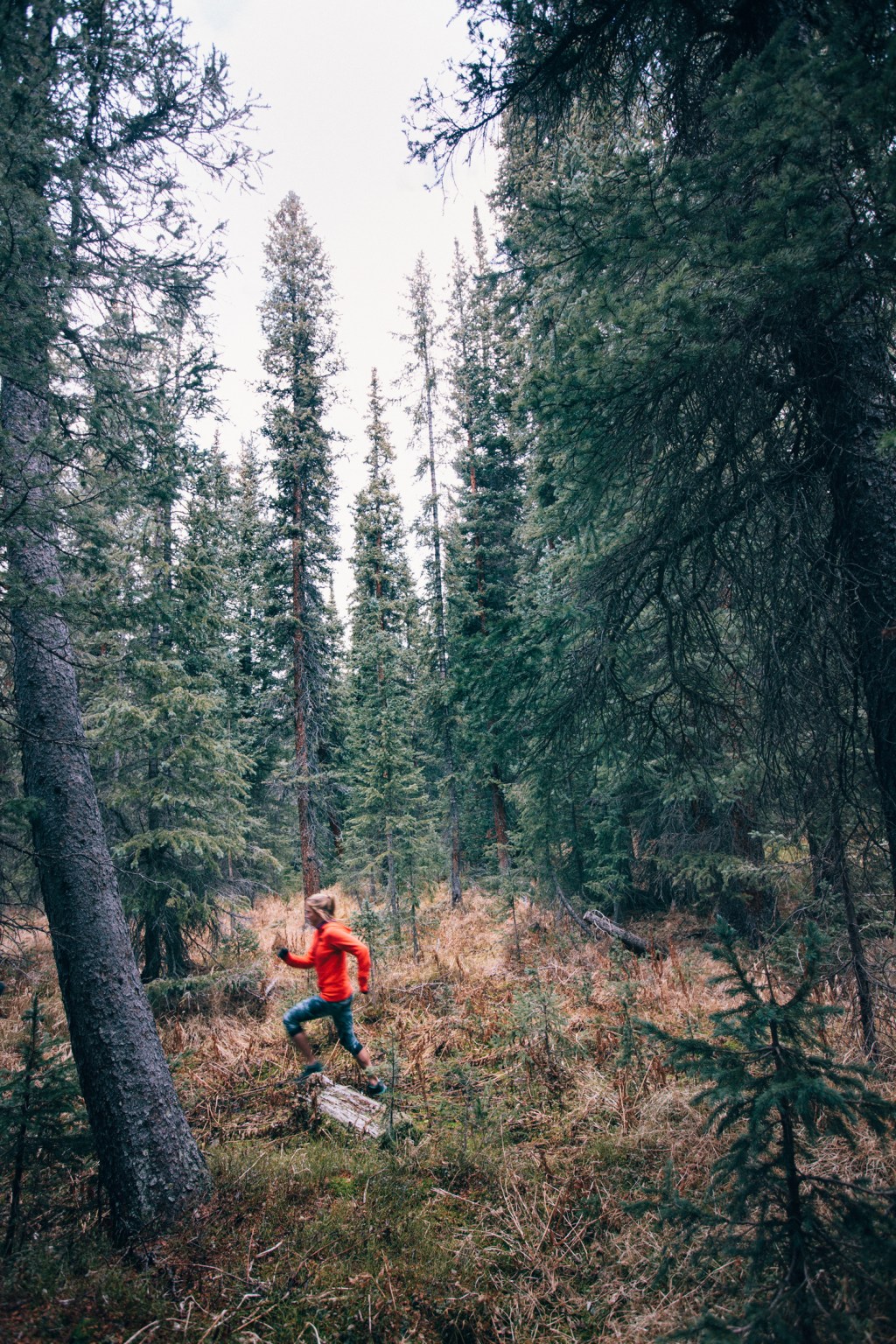 Clare Gallagher running in woods