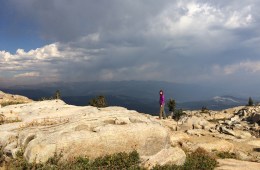 female standing at a mountain overlook