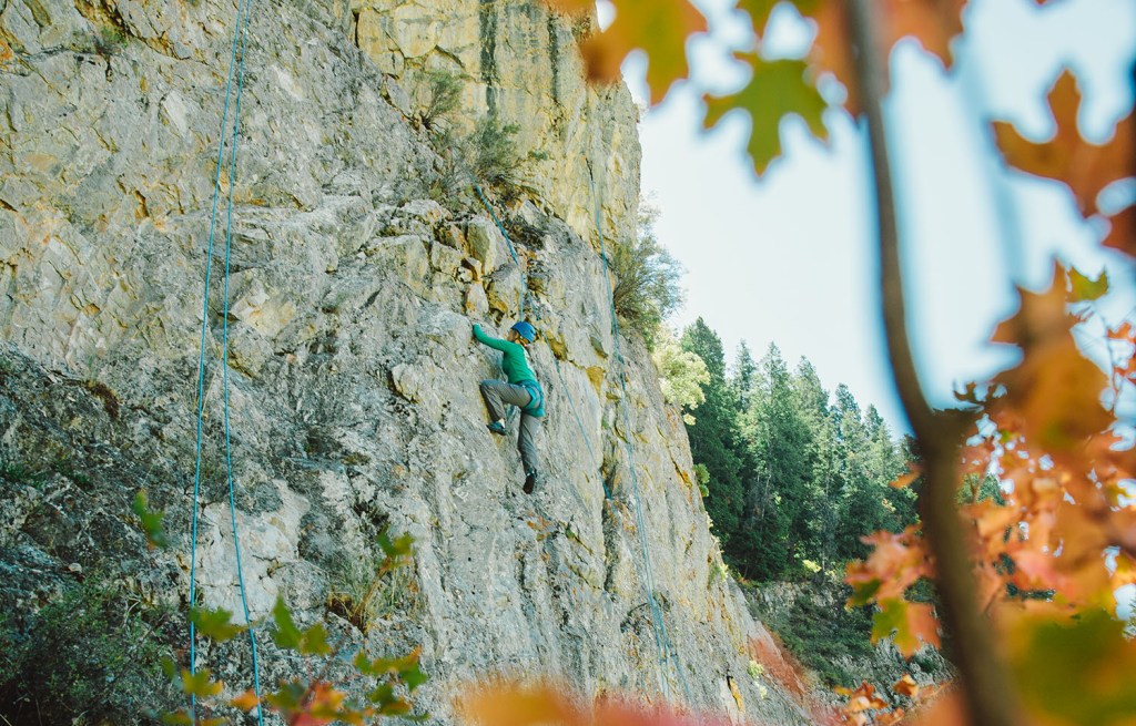 Woman climbing rocks