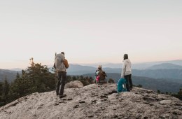 Three backpackers looking at a view