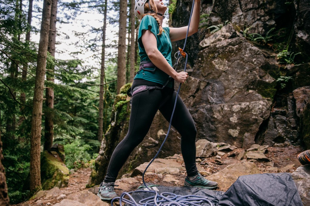 female rock climber on belay