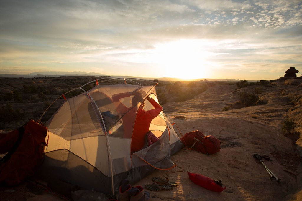 Person in tent while camping