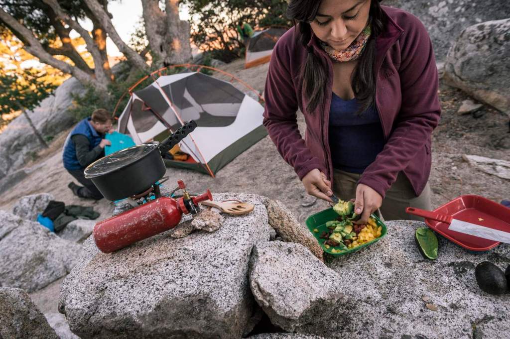 Backpacker making dinner