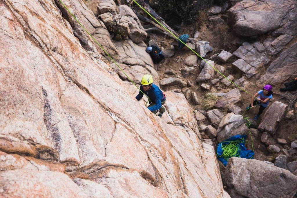 One person climbing, the other belaying