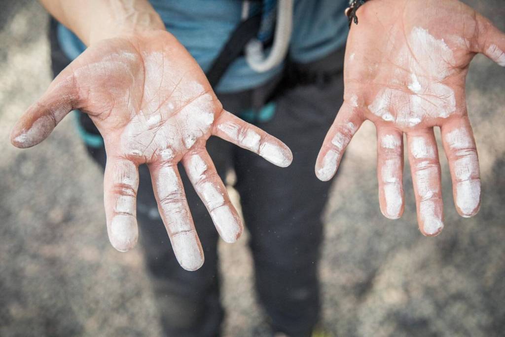 Hands with chalk on them