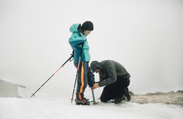 Alex Dahinten adjust Kathy's crampon prosthetic attachment