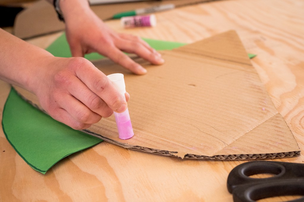 Cover cardboard in wrapping paper