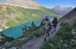 Nate and Alex hike along Gunsight Pass Trail in Glacier National Park