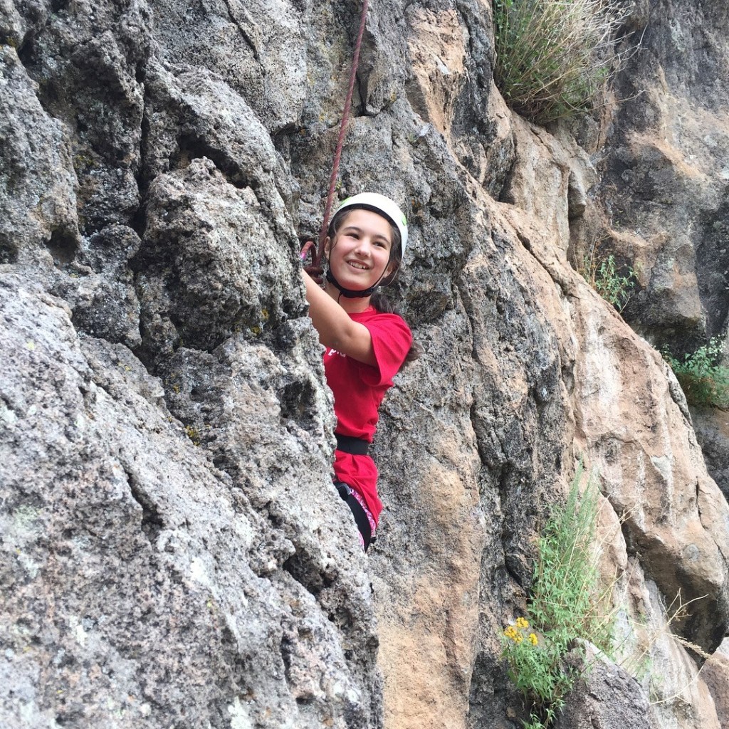 Girls Inc participant rock climbing