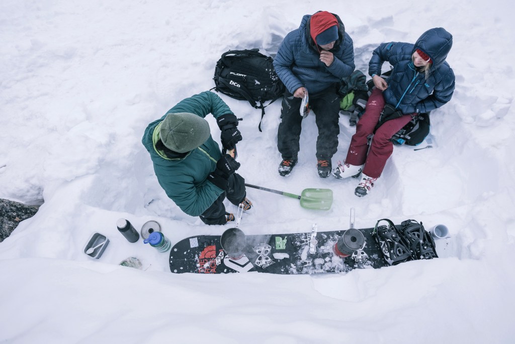 People cooking in snow