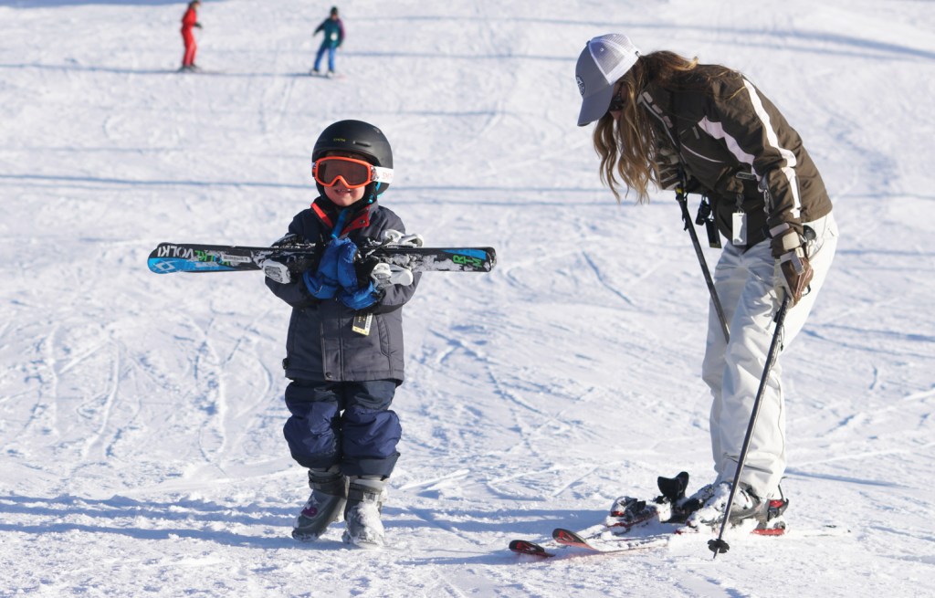 Anna and her son skiing