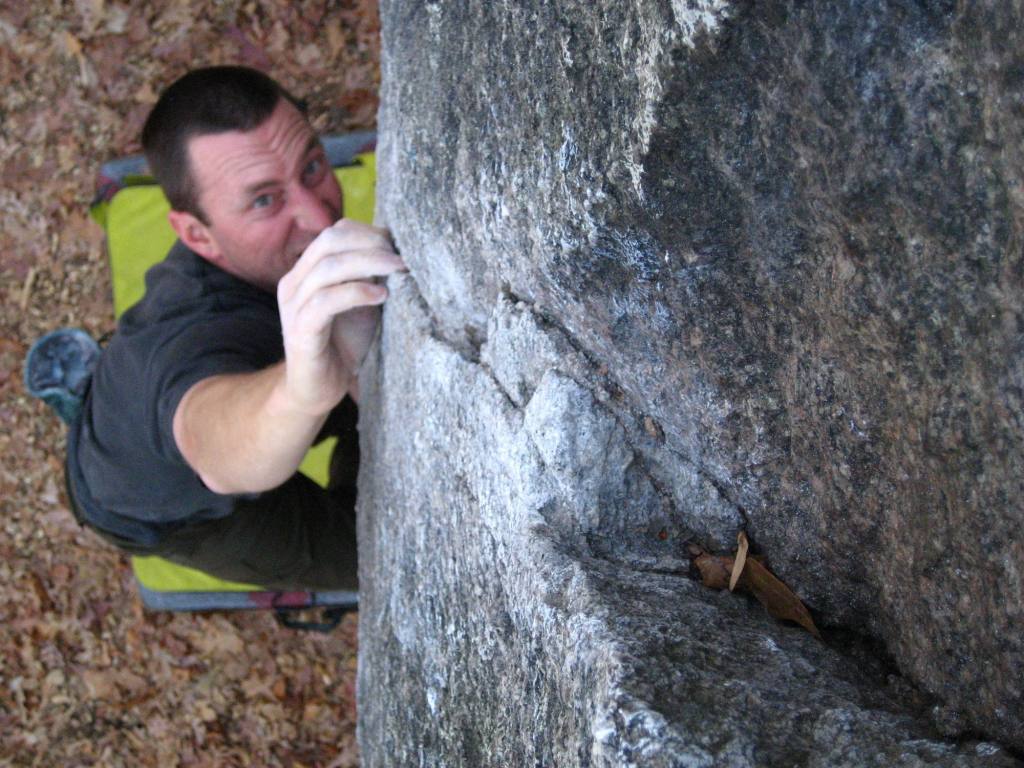 A climber tackling a bouldering problem at Boat Rock.