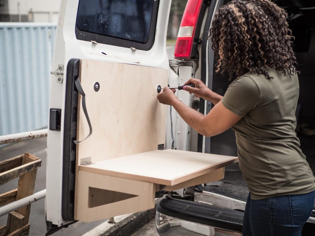 Attaching table to vehicle door