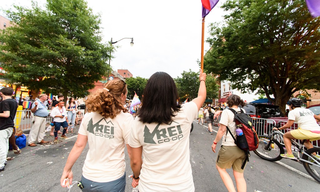 Becky Smith, general manager for the REI flagship store in Washington, D.C., held her partner's hand.