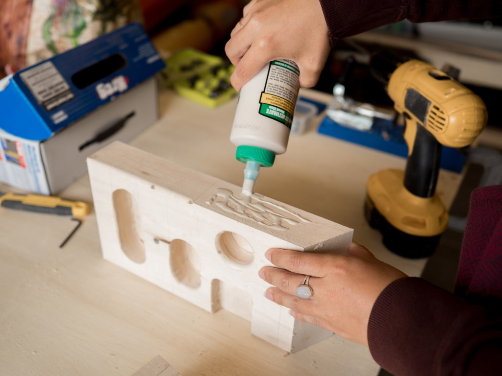 apply wood glue to the parts of the walls that touch the center block