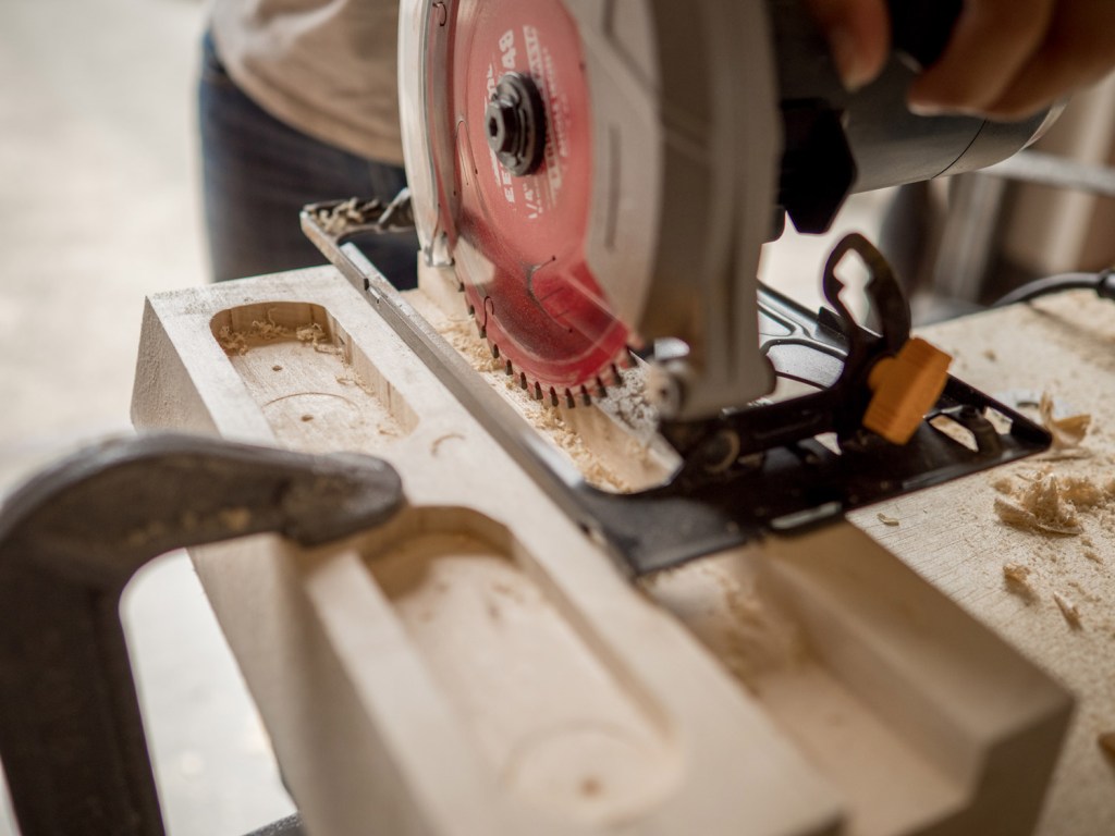 use a radial saw to make a series of close-set cuts across the length of the board