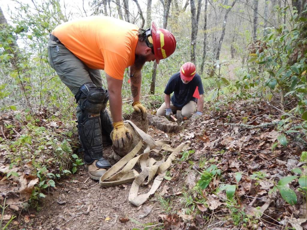 Volunteers working on a trail