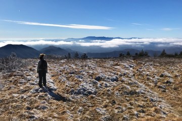 A woman taking in the view in a snowy field