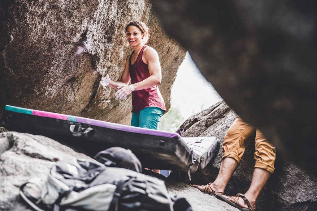 A shot of Edwards near a boulder with her crash pad