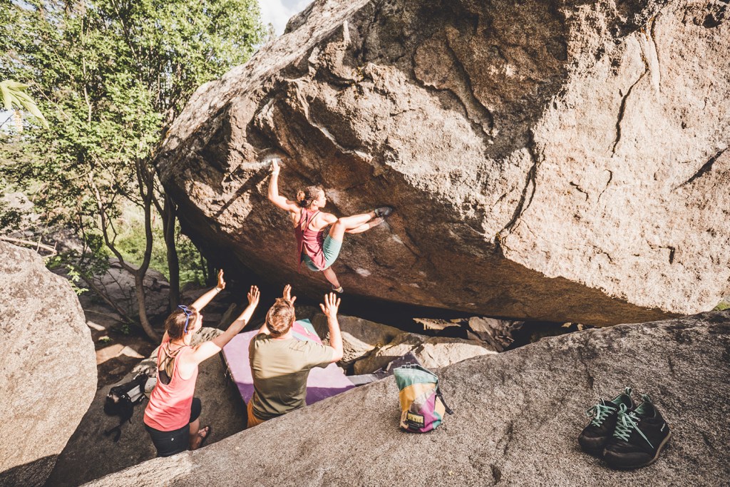 Friends spotting Edwards as she climbs