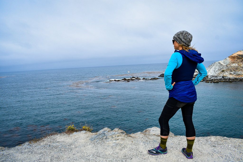 On Santa Catalina Island, Williams stands atop the "Whale's Tail" that separates Little Harbor from Shark Harbor.