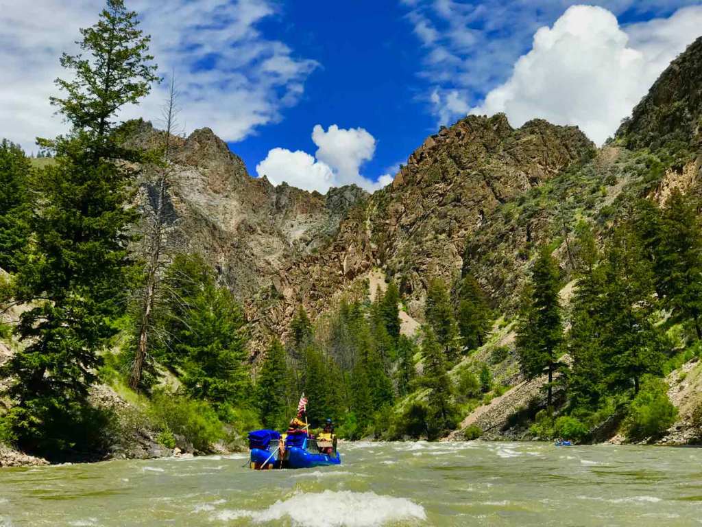 After leaving Lower Grouse, the gorge’s character morphs into rougher and more rugged environment. Far and Away Adventures raft guide Galen Barker steers the sweep boat, which carries the team's camp gear. 