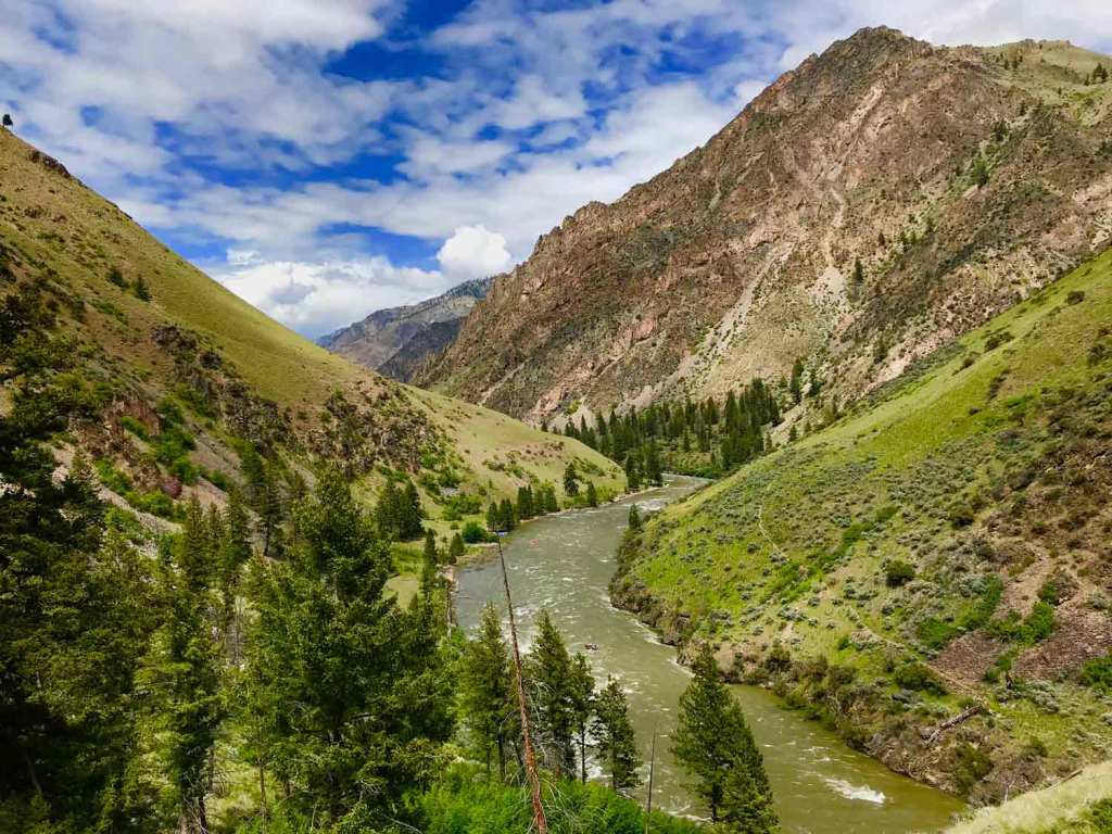 The bright-green hillsides that surround the Middle Fork carry an effervescent glow from the spring showers. Here, the team looks downstream from Johnson Point, a steep hike that’s near mile 70 and Little Pine camp.