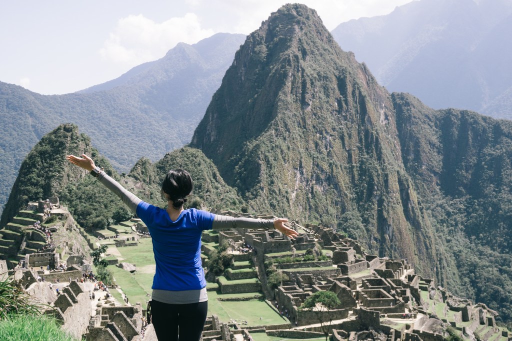 A woman rejoicing at the sight of a mountain