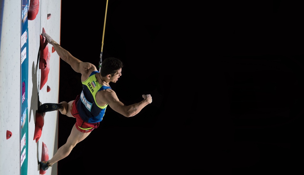 World record holder Reza Alipour of Iran celebrates on the wall.