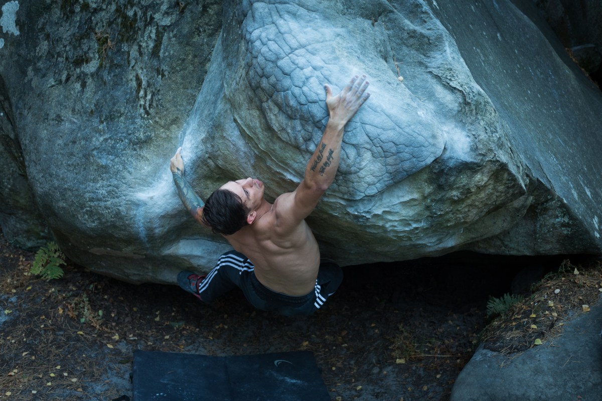 Justin Salas climbing a boulder problem.