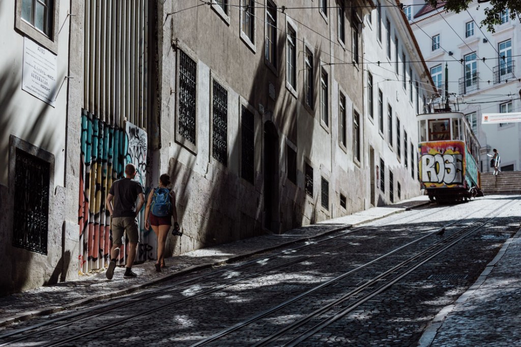 Cable cars climb through Lisbon.