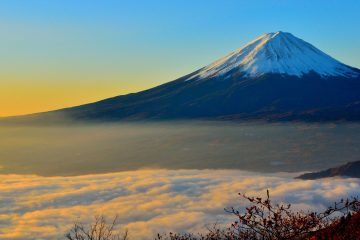 Mount Fuji reflects the glow of sunrise.