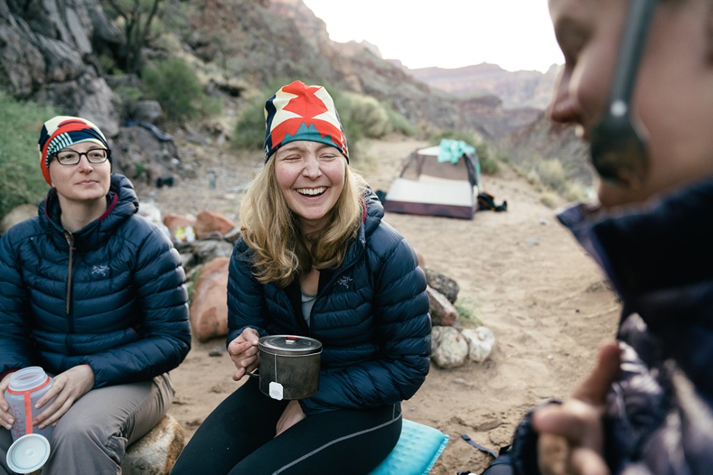 Campers enjoy cups of tea.