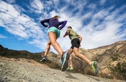 Two HOKA ONE ONE runners run up a trail