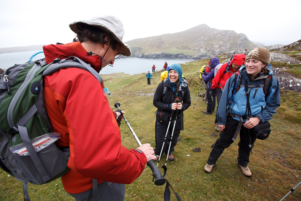 Hikers take a rest from a misty trek.