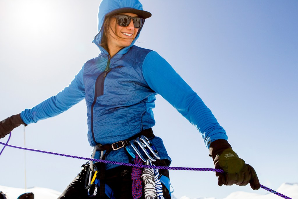 Stephanie Mawson practicing her crevasse rescue skills while a smile. 