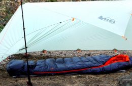 A tarp shelter sits ready for camping.
