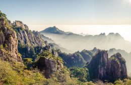 Huangshan refracts sunlight above the clouds.